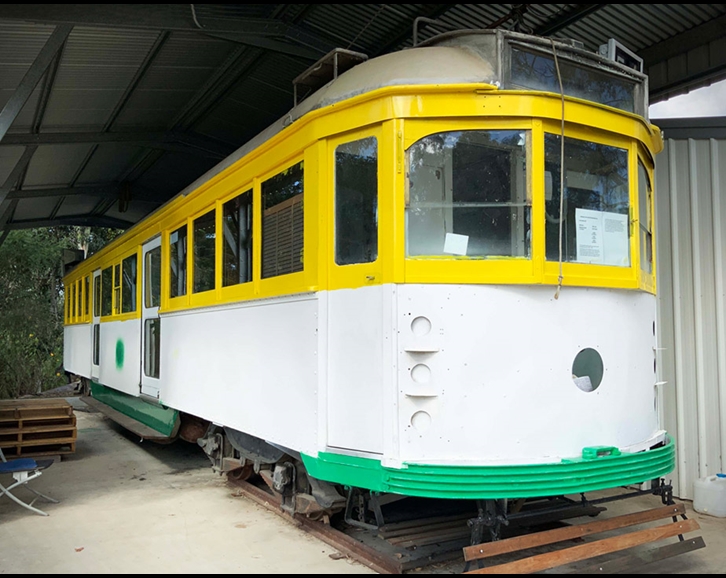 An old Melbourne tram that is being repainted.